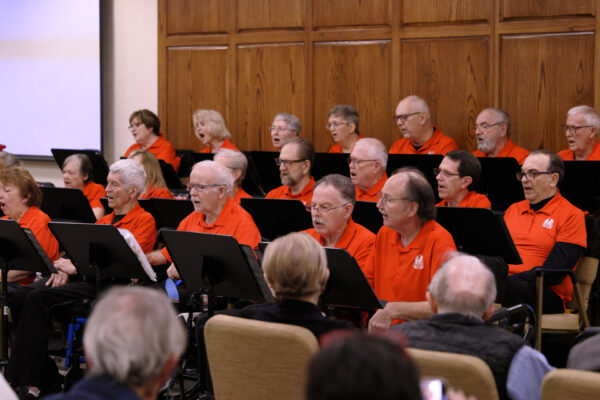 A group of people with Parkinson's sing together